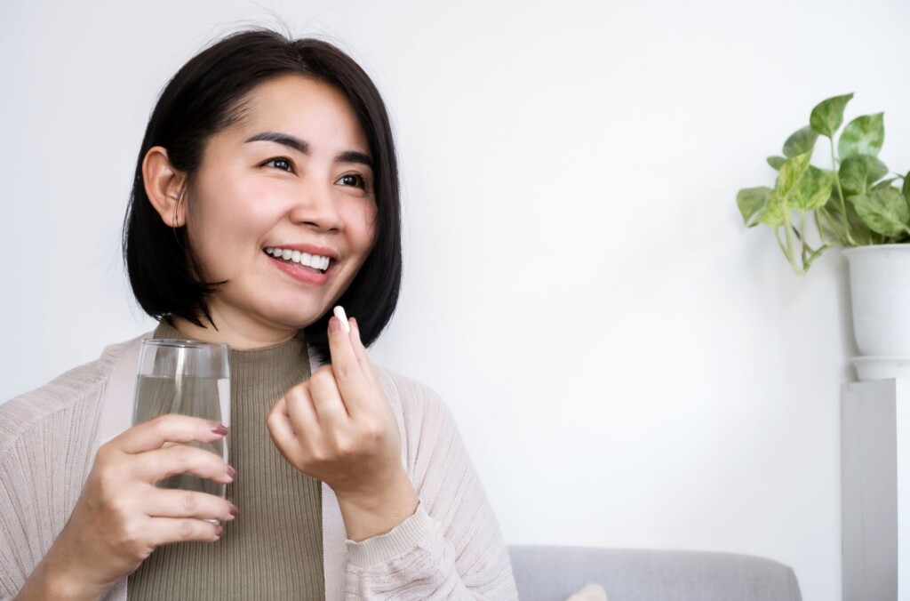 woman taking medicine